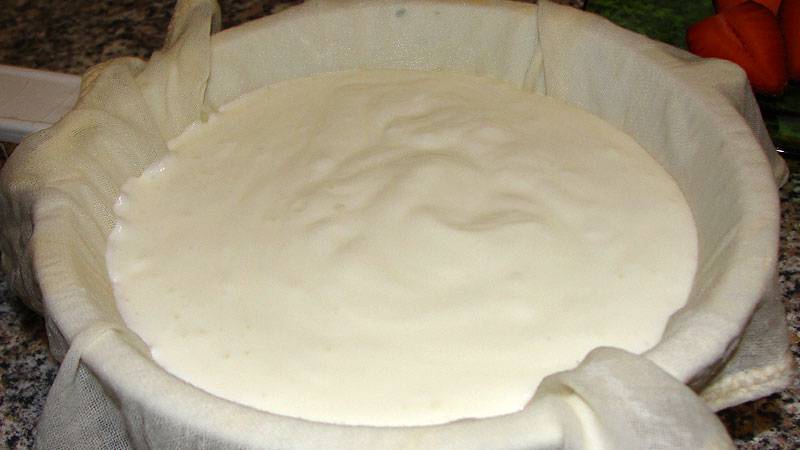 Pour both curd and whey into a strainer with a cheese cloth